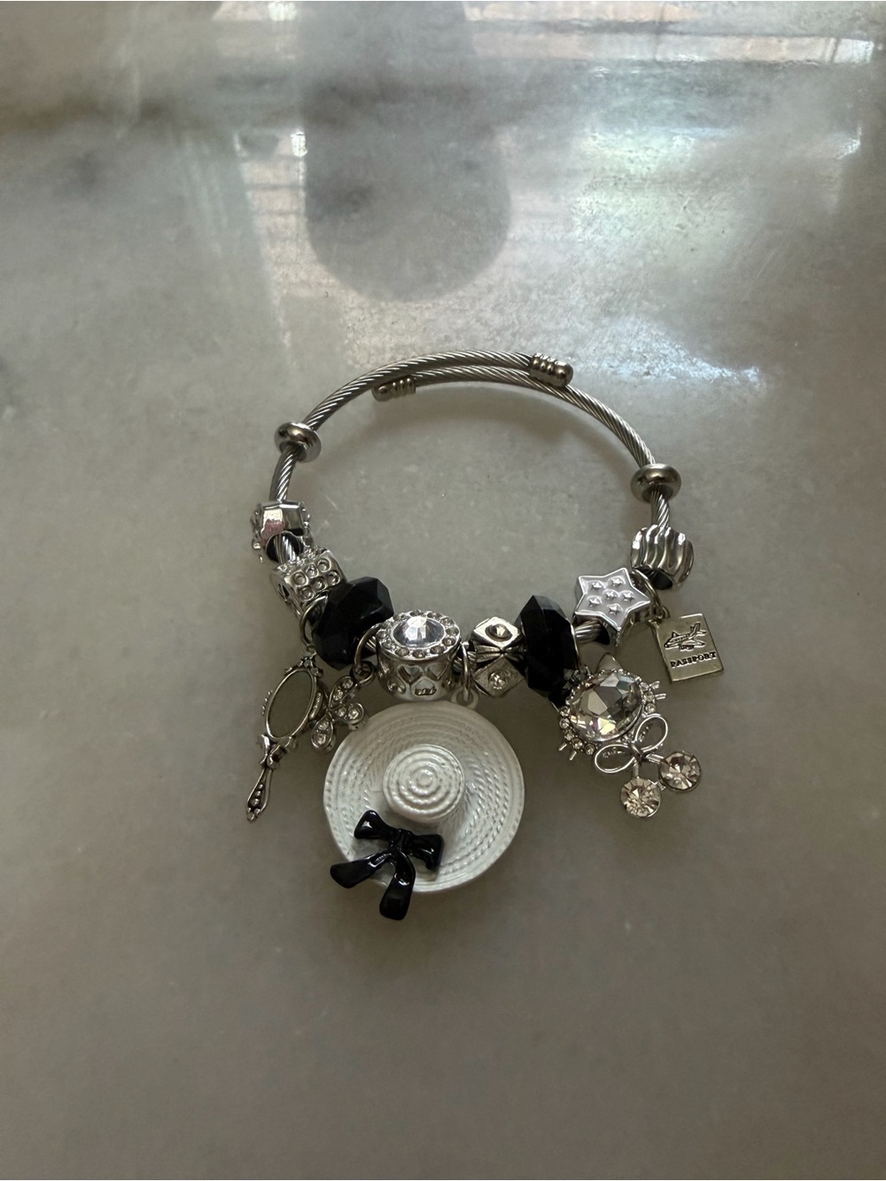 Silver Charm Bracelet with White Hat and Black Accents